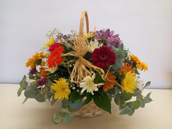 colourful mixed flowers in a basket babsi george delivery