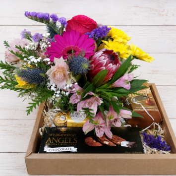 Small Seasonal Flower posy accompanied by Lindt Assorted 75g, Angel Biscuits 150g and Ferrero Rocher T3